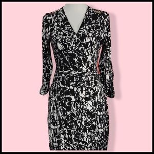 CALVIN KLEIN Wrap Dress in Black and White Pattern.